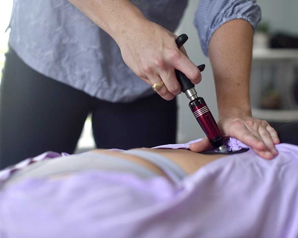 Central Texas Chiropractic - photo of a Chiropractor using an activator
